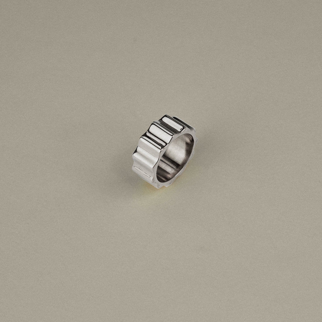 Silver ring on a beige background